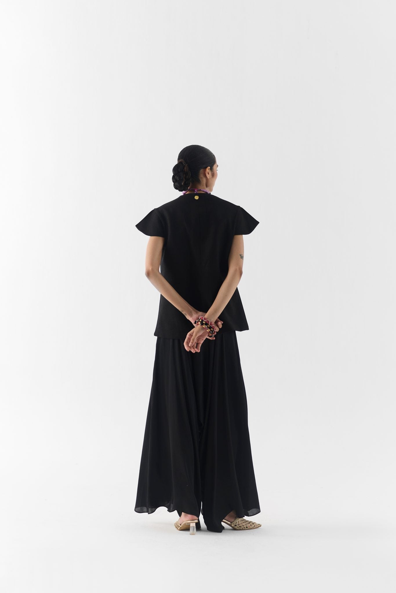 Fabric and garden rose print detail of the Black Garden Rose vest and dhoti pants