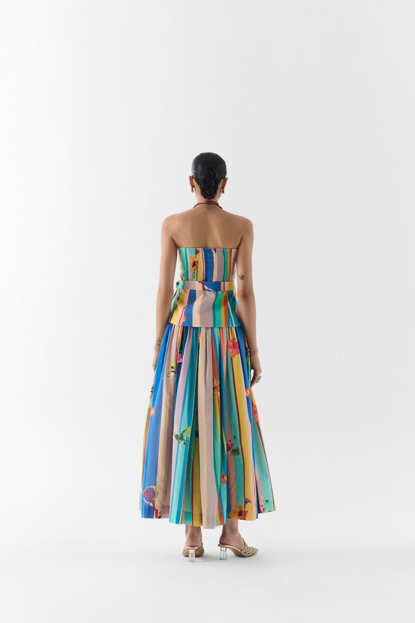 Close-up of blue barcode print fabric detail on the off shoulder top and skirt set