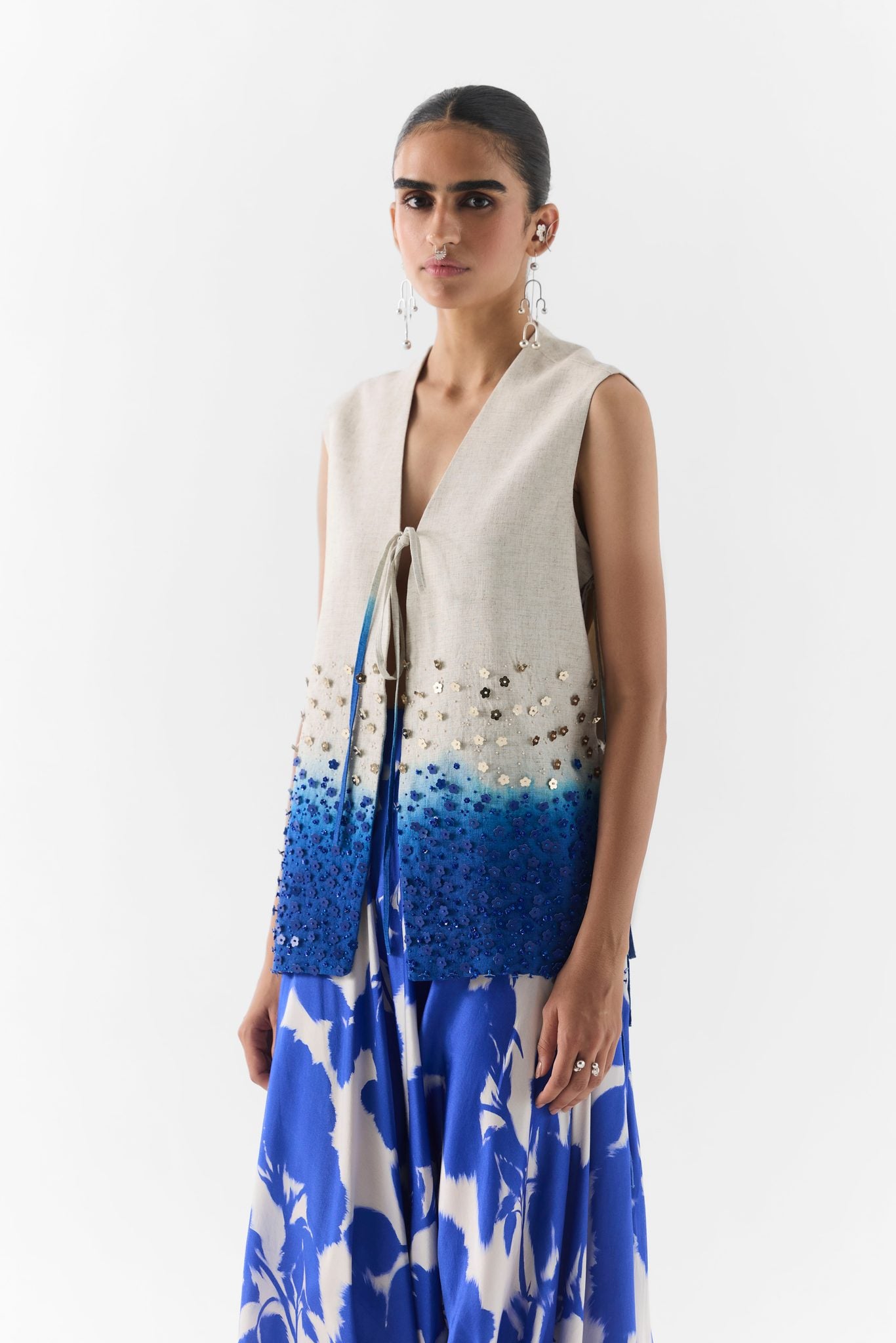 Side view of Blue Ink dhoti pants with draped pleats and fitted vest