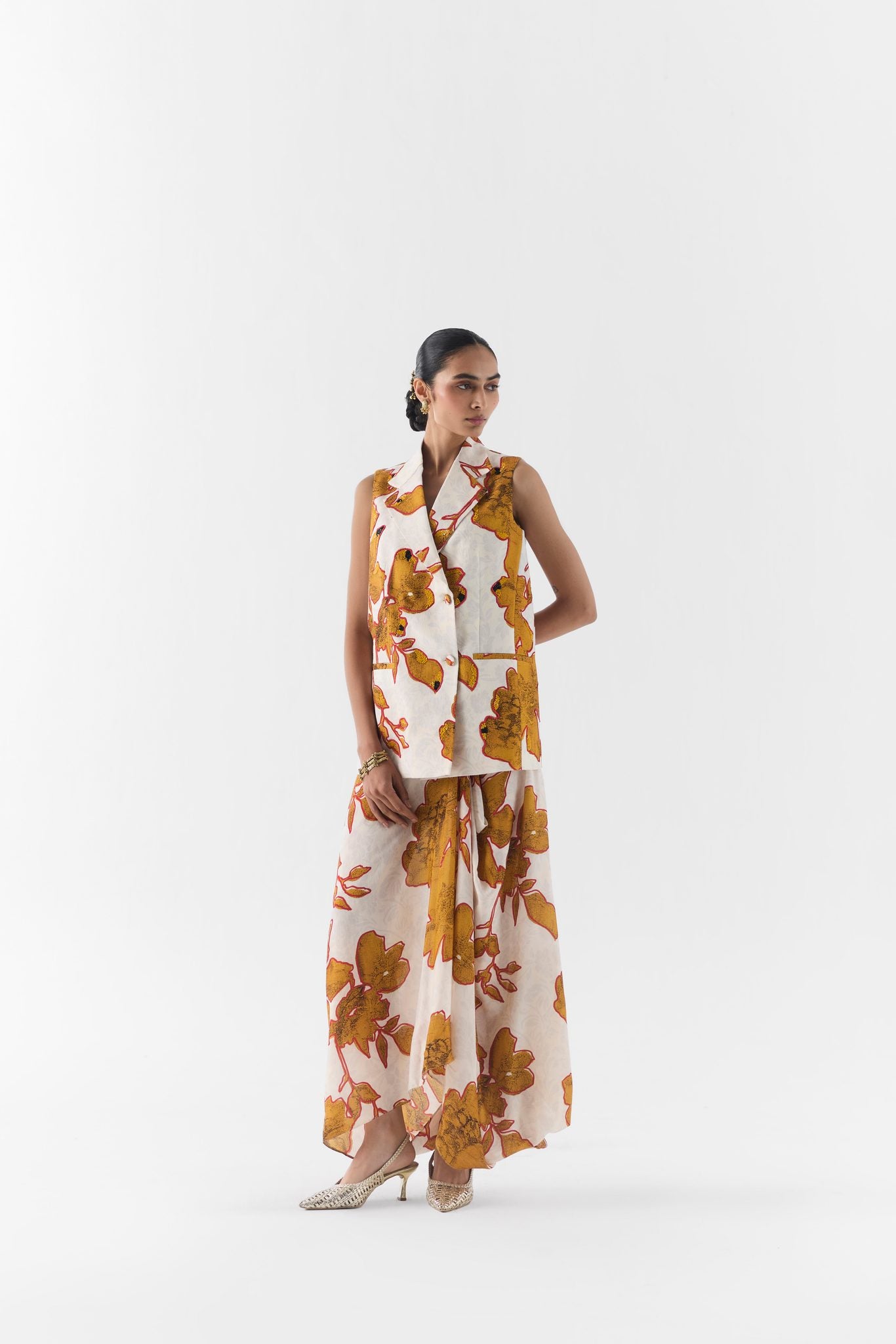 Side view of the Elara tailored blazer with knot-detail skirt