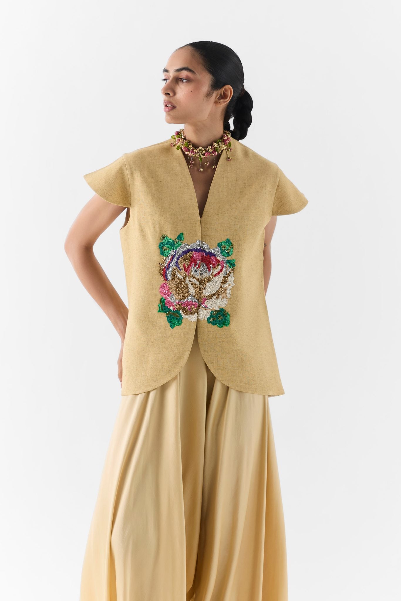 Side profile of the Gold Garden Rose vest with softly draped dhoti pants