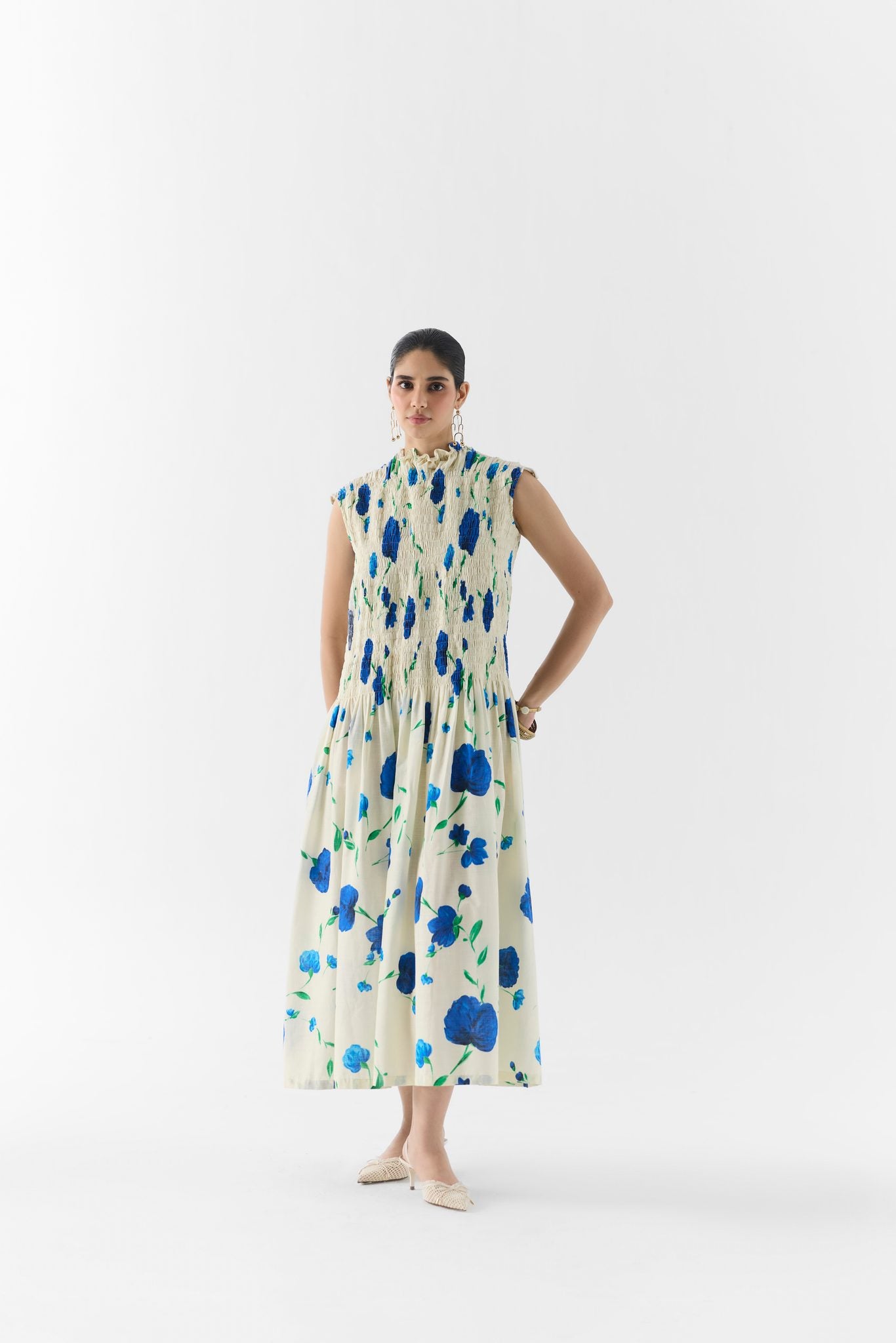 Side view of the Moss Rose ruched dress showing gathered waist