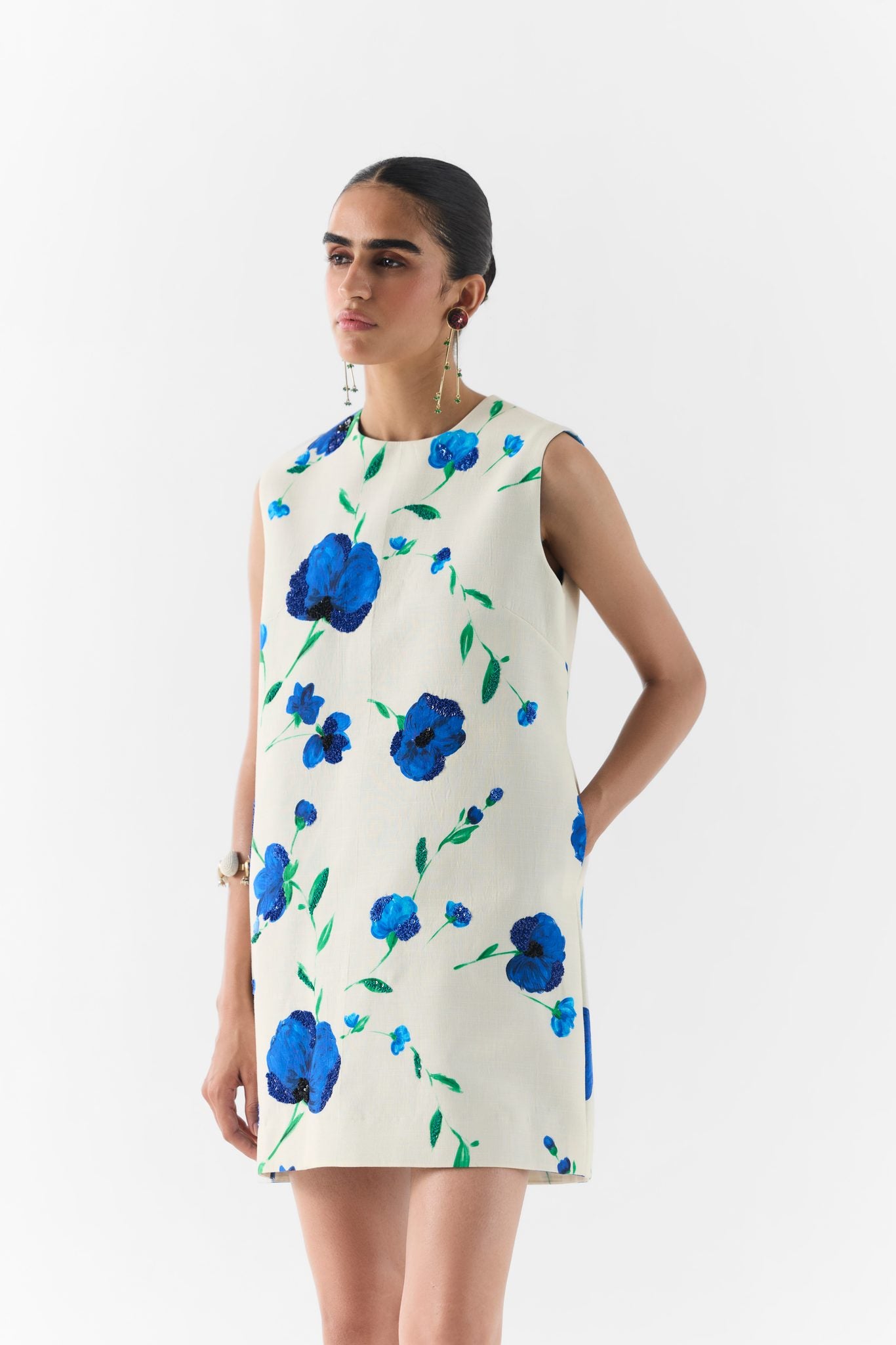 Side view of the Moss Rose short dress showing silhouette and hem