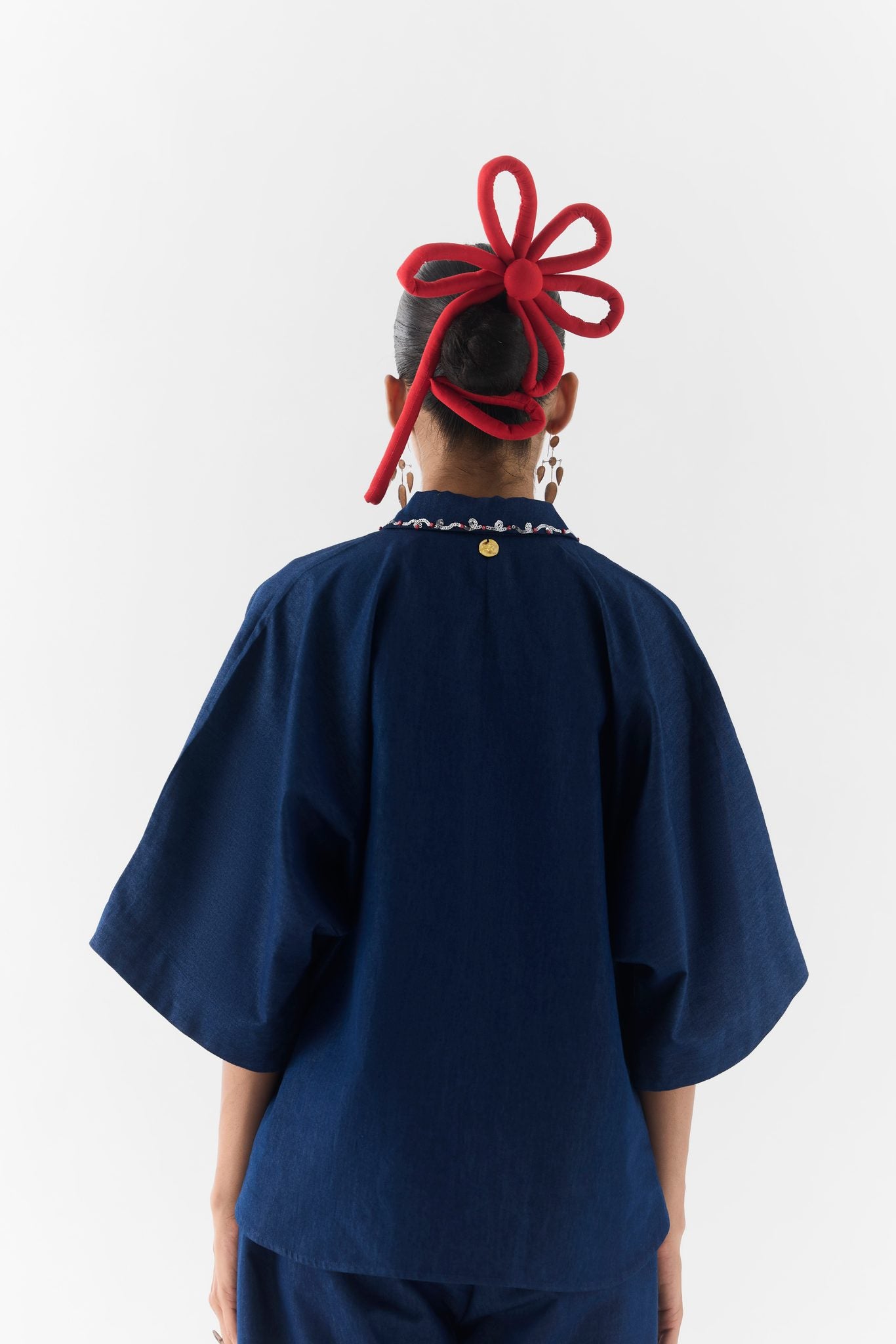 Posy Denim Co-Ord front view on model, floral embroidered denim top and matching trousers