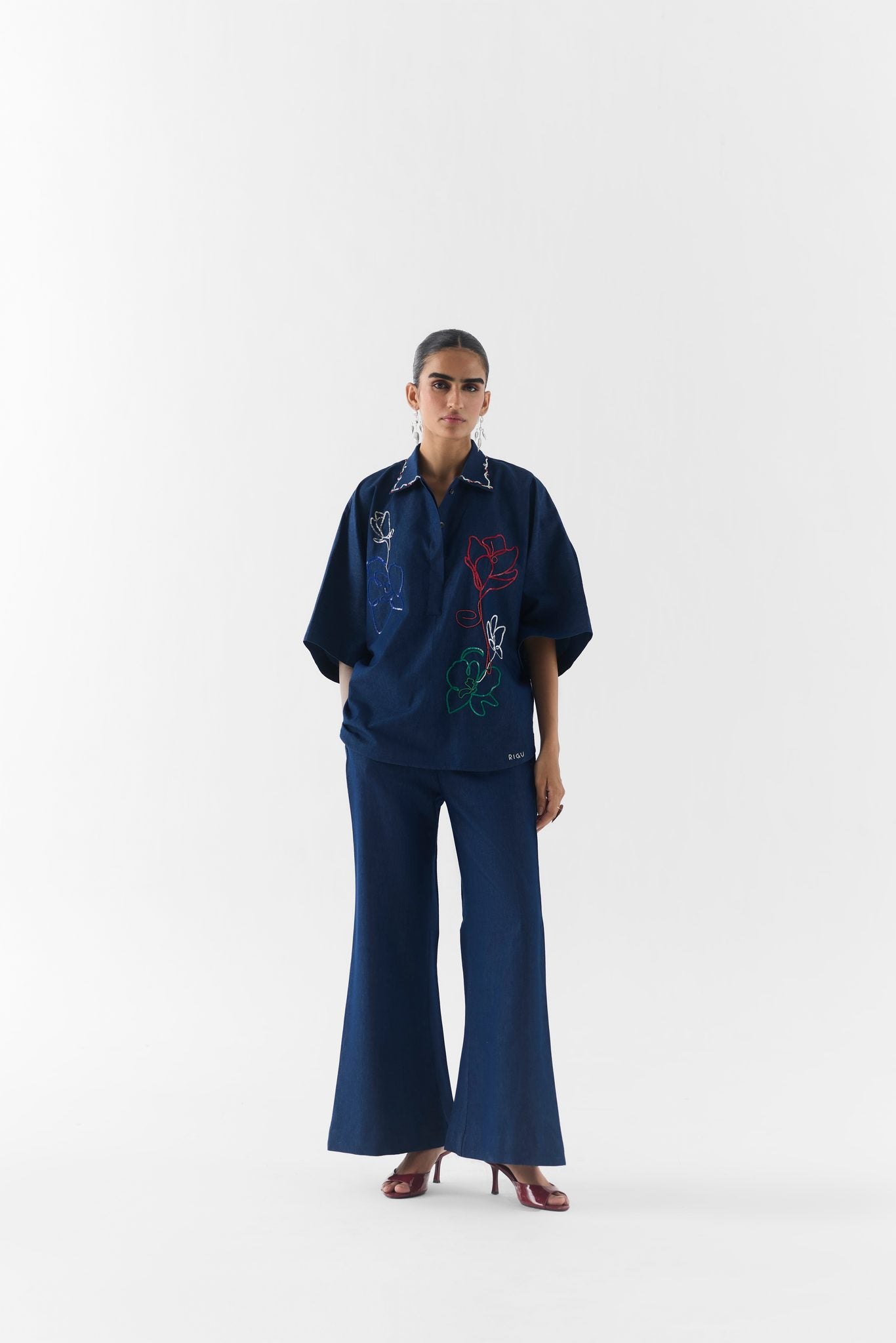 Side view of the Posy Denim Co-Ord showing tailored fit and clean denim silhouette