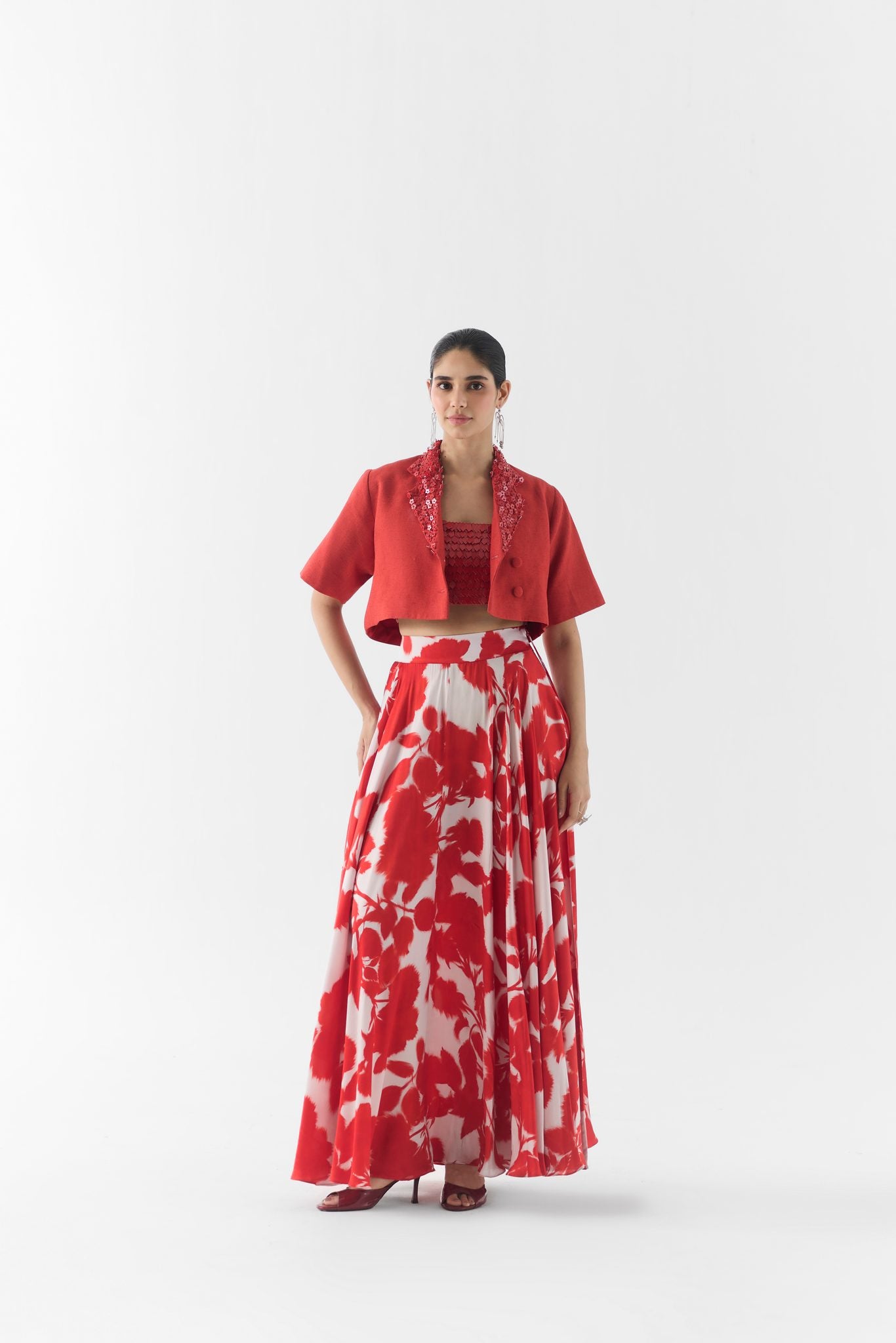 Side view of Red Ink leather skirt showing silhouette and blouse fit