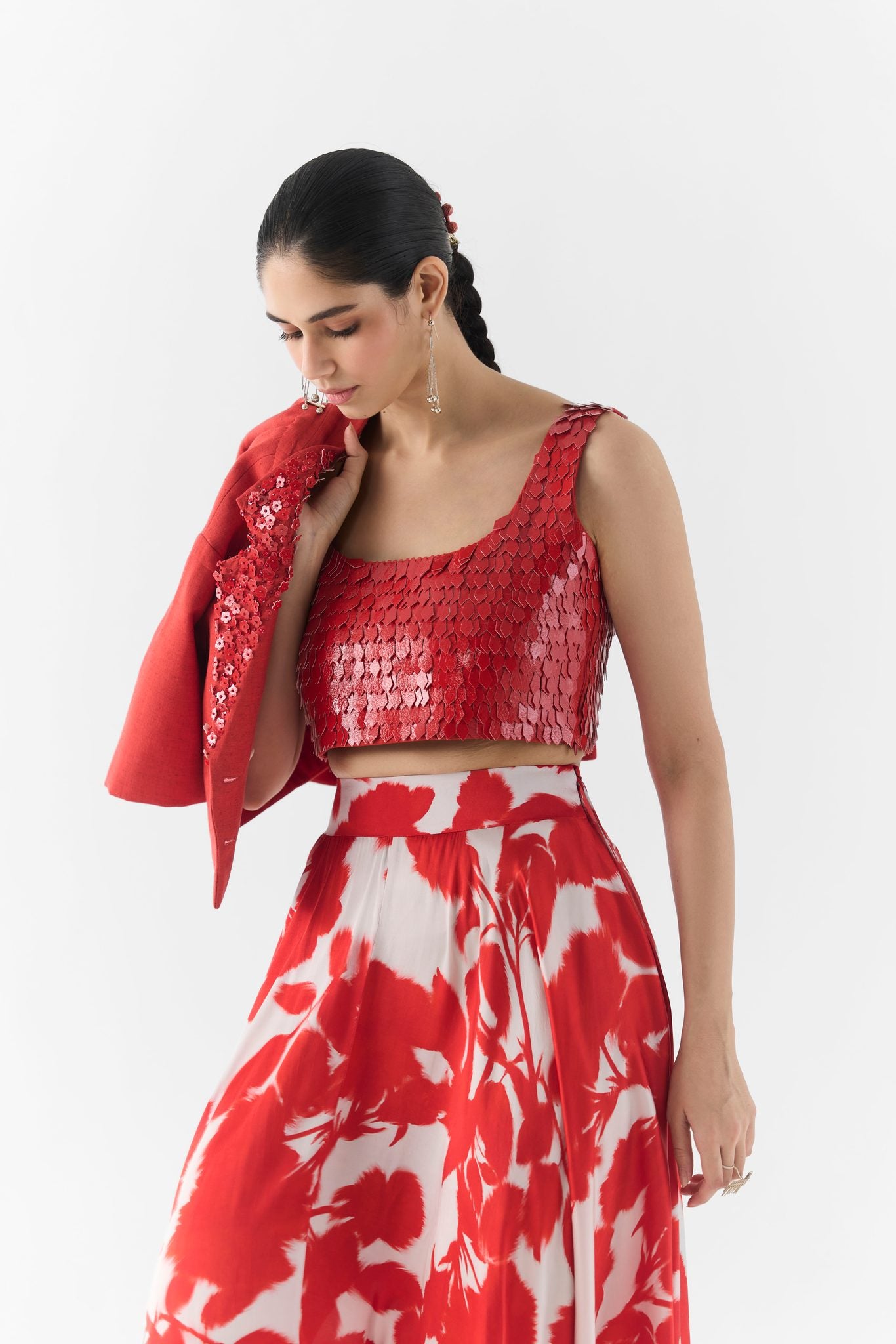 Leather texture and red ink print detail on Studiorigu blouse and skirt