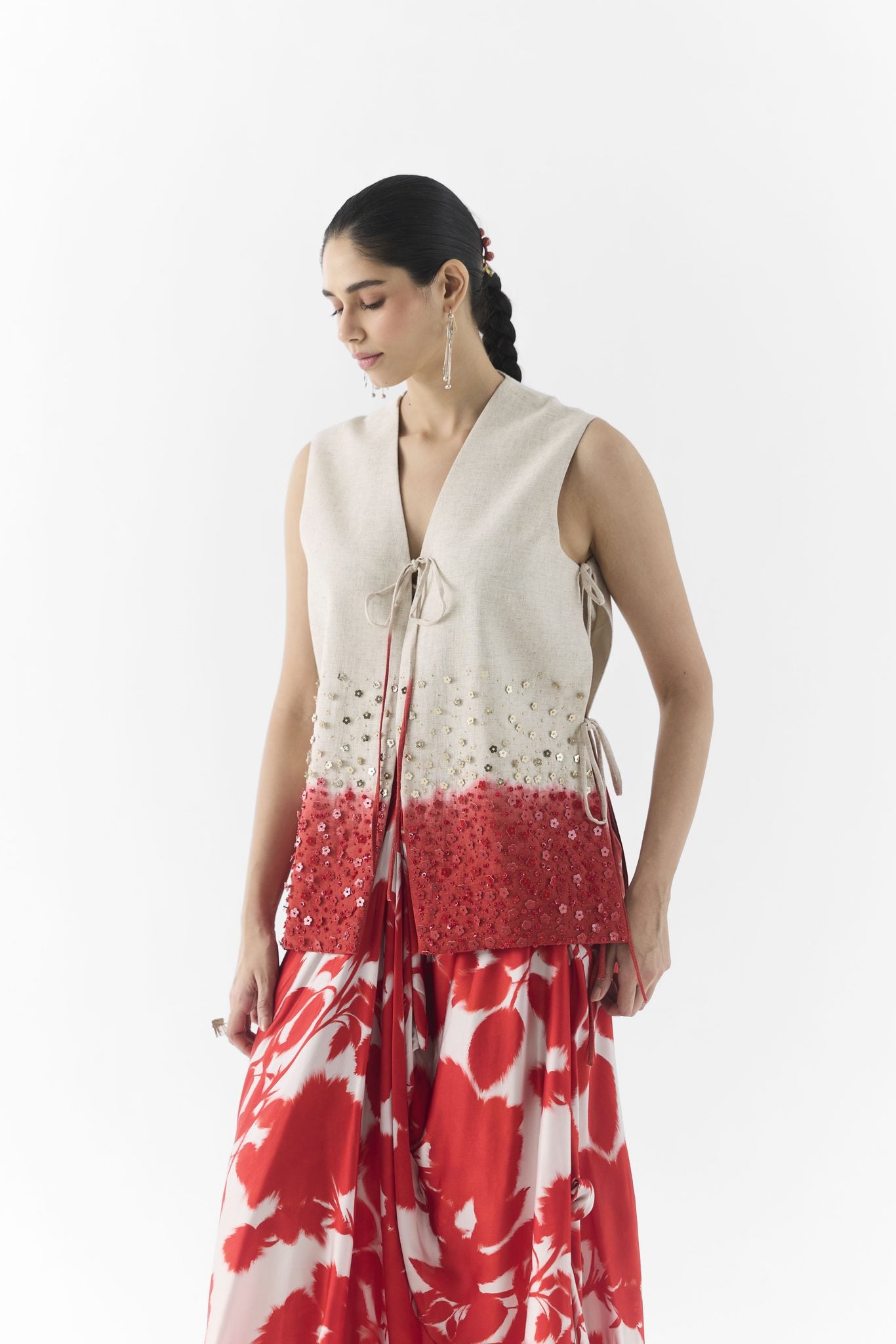 Side view of Red Ink dhoti pants showing draped pleats and tailored vest