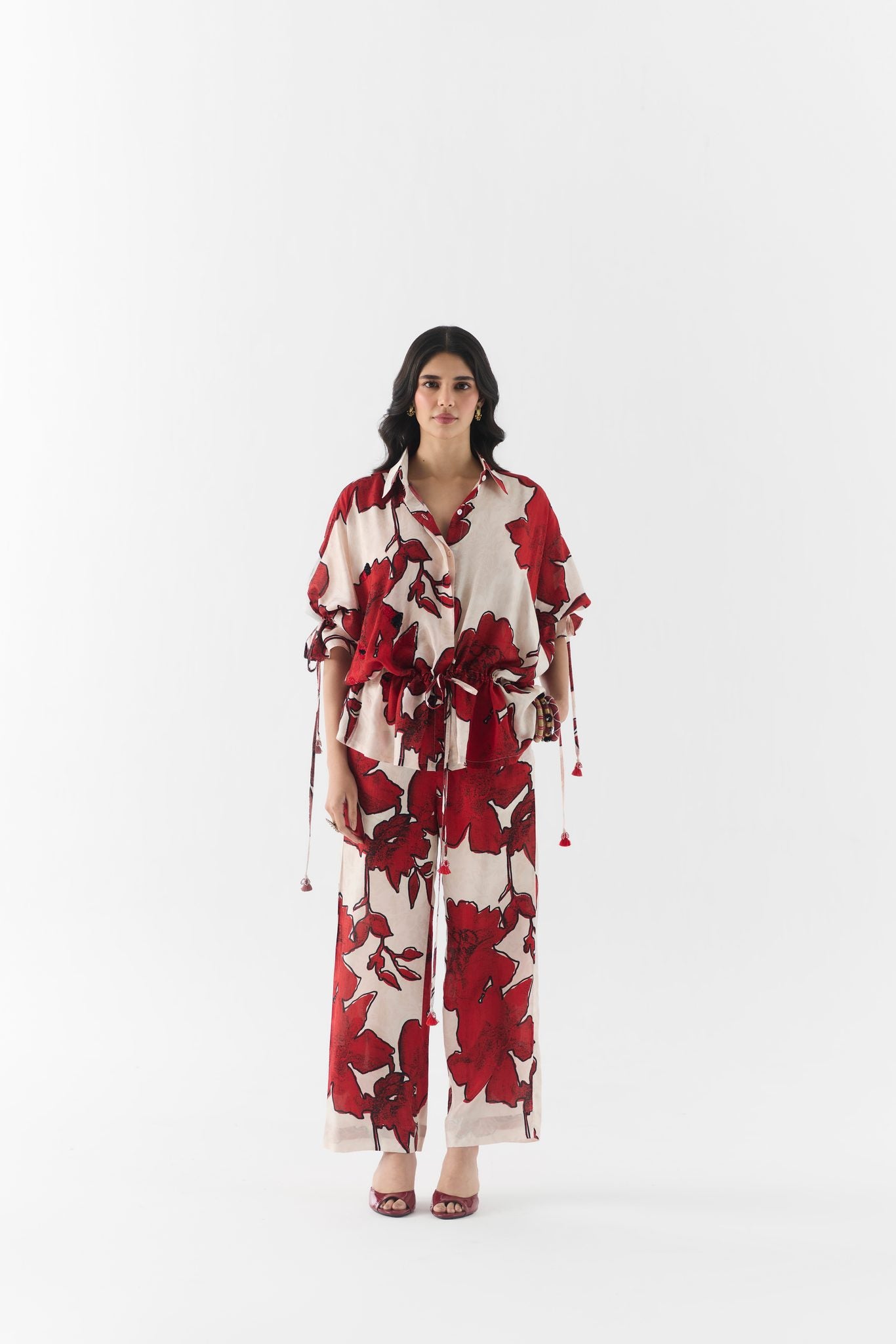 Cream and red floral print Rosalie drawstring shirt and trousers co-ord, front view on model