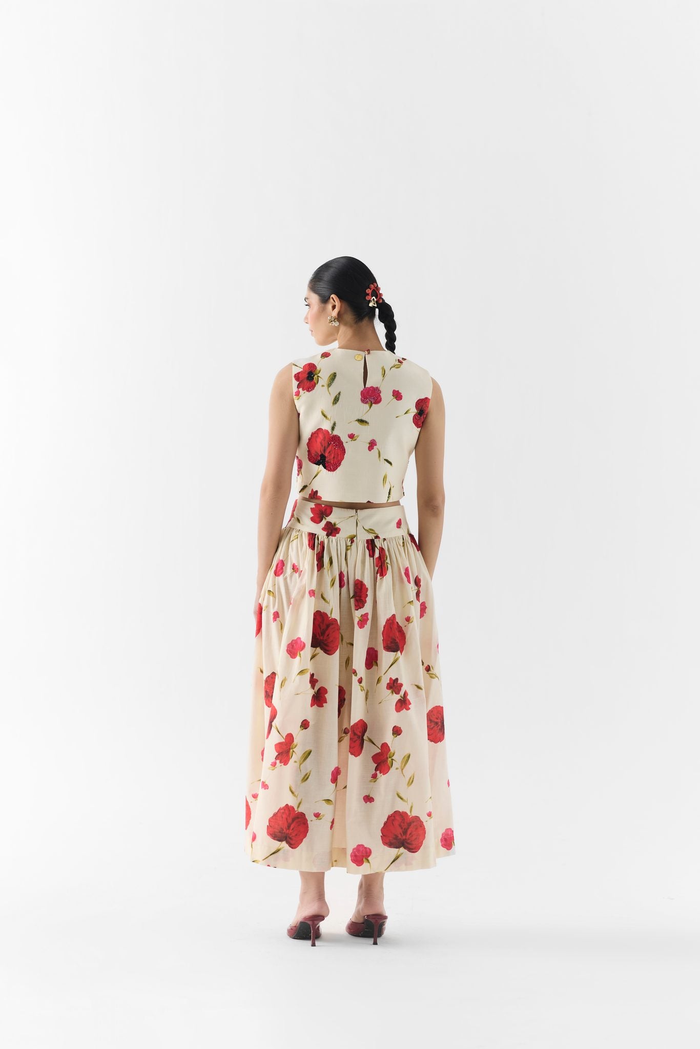 Side view of the Sisley Rose crop top with flowing skirt and fitted waistline
