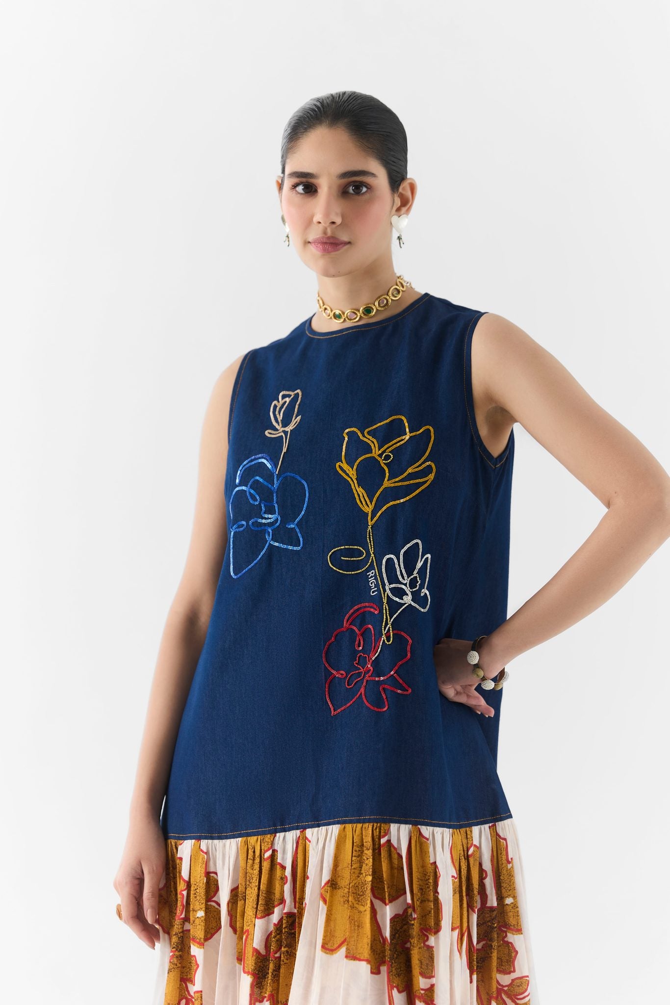 Side view of the Elara denim A-line dress showing flared hem