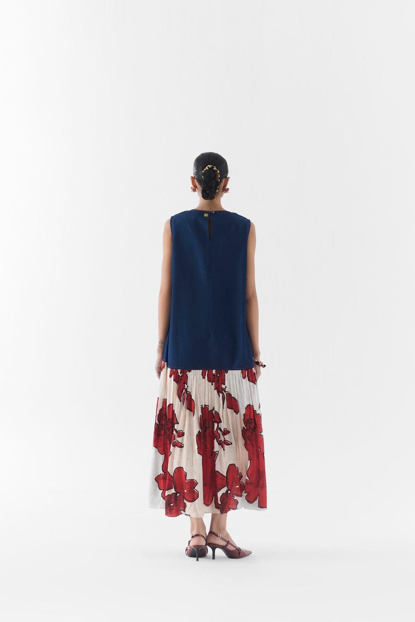 Detail of Rosalie denim A-line dress embroidery and A-line silhouette