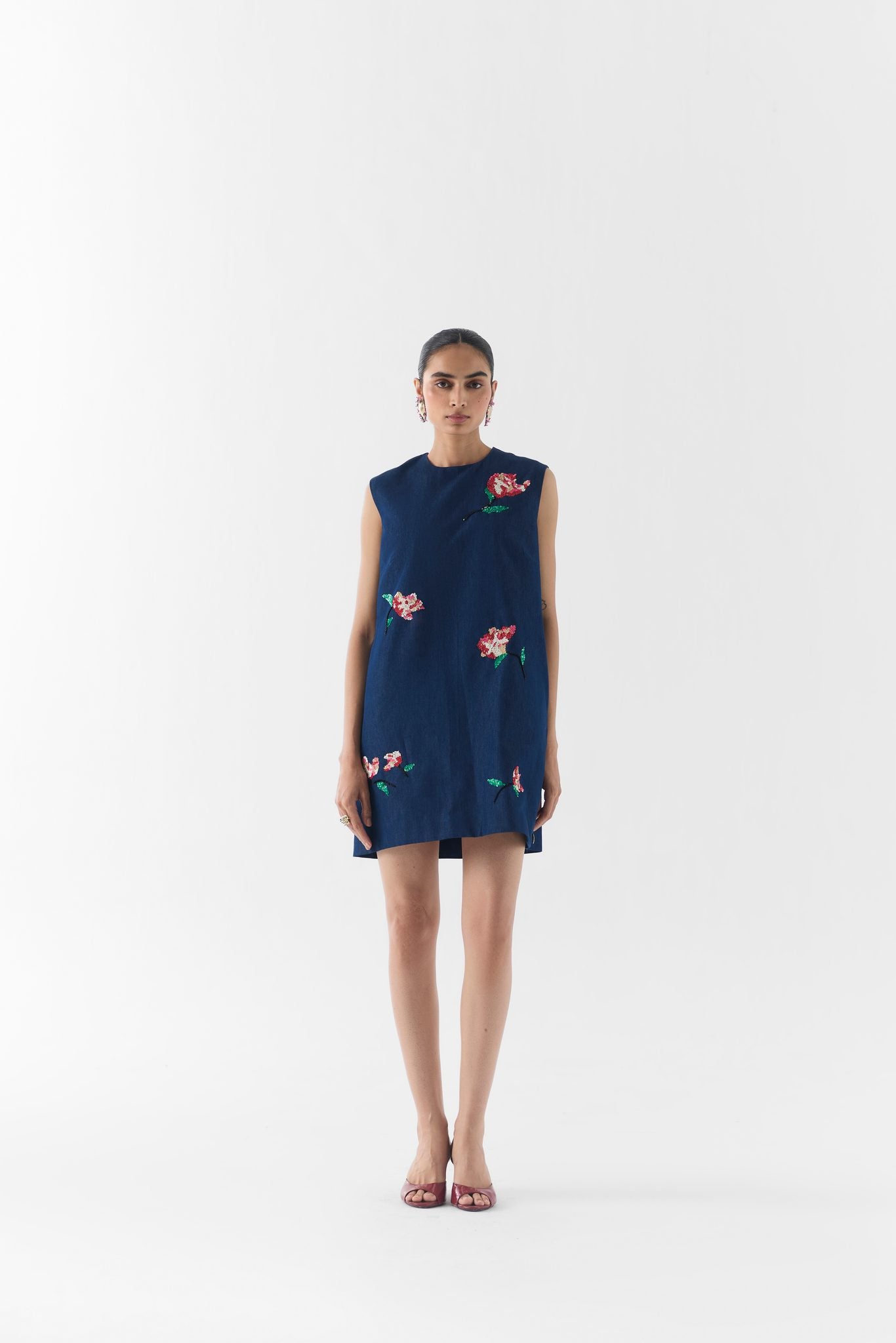 Side view of the Rose Denim Dress showing its structured A-line silhouette