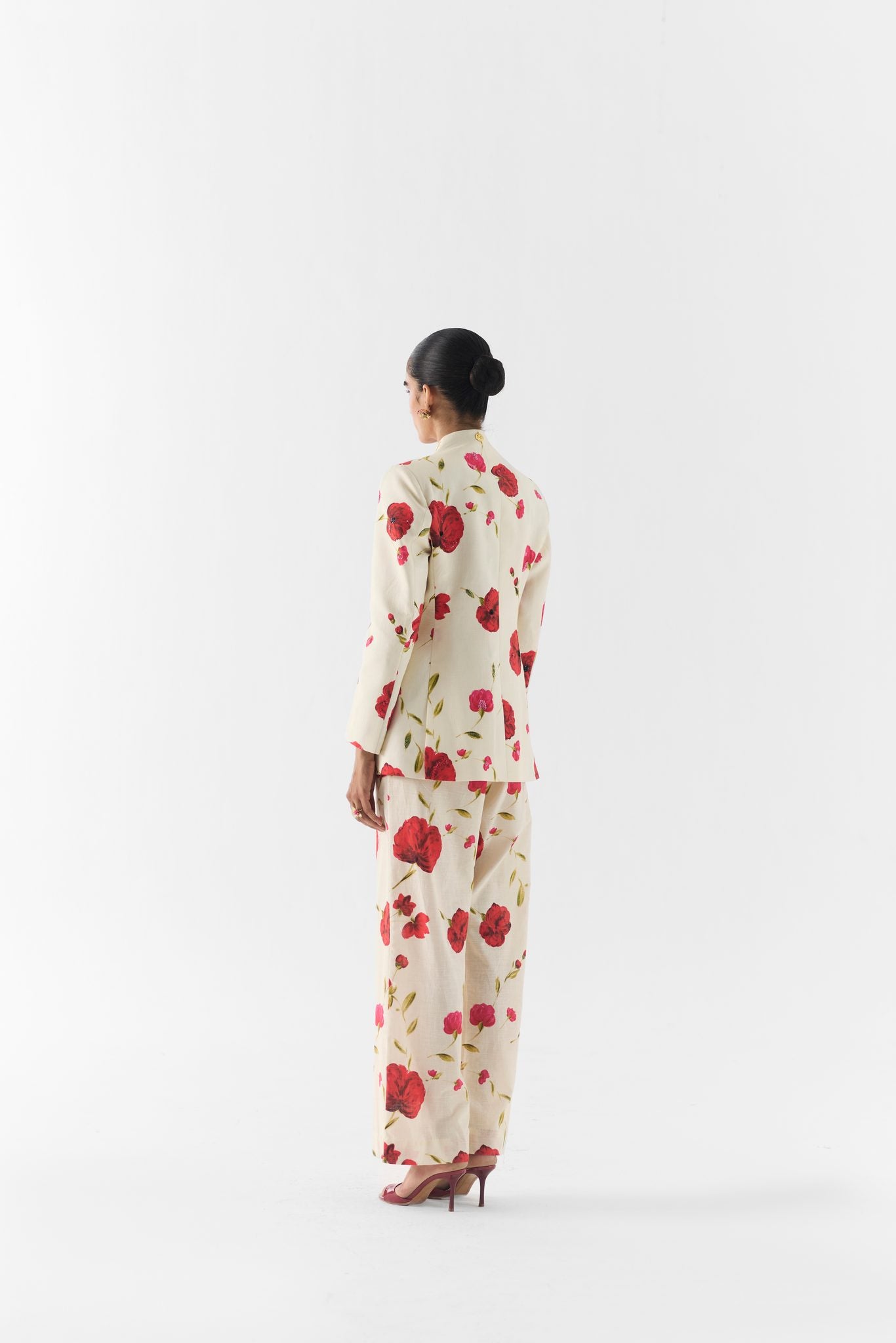 Close-up of Sisley Rose print fabric and blazer button detail